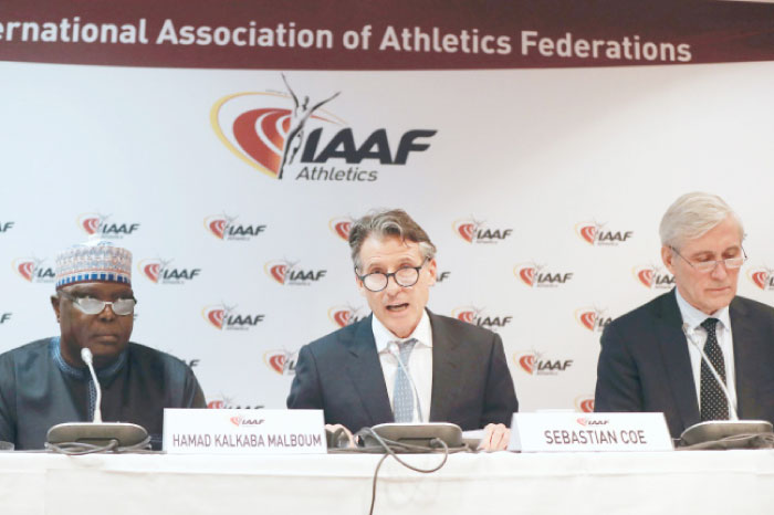 International Association of Athletics Federations (IAAF) President Sebastian Coe (C), flanked by IAFF vice-president Hamad Kalkaba Malboum (L) and chairperson of the IAAF Taskforce Rune Andersen (R), speaks during a press conference following the 208th IAAF Council meeting on Monday in Monaco. — AFP