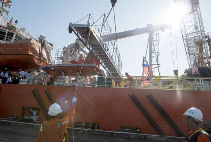 A Malaysian ship carrying aid for Rohingya arrives in Yangon’s Thilawa port while Myanmar port personnel looks on in this Feb. 9 file photo. — AFP