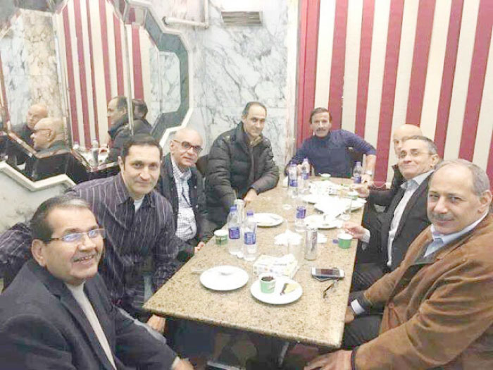 Gamal and Alaa Mubarak at a regular fish restaurant in Shubra without bodyguards. — Social media photo