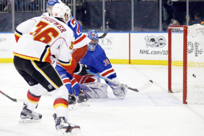 Calgary Flames right wing Troy Brouwer (36) scores a goal past New York Rangers goalie Henrik Lundqvist (30) during the third period at Madison Square Garden. — AFP