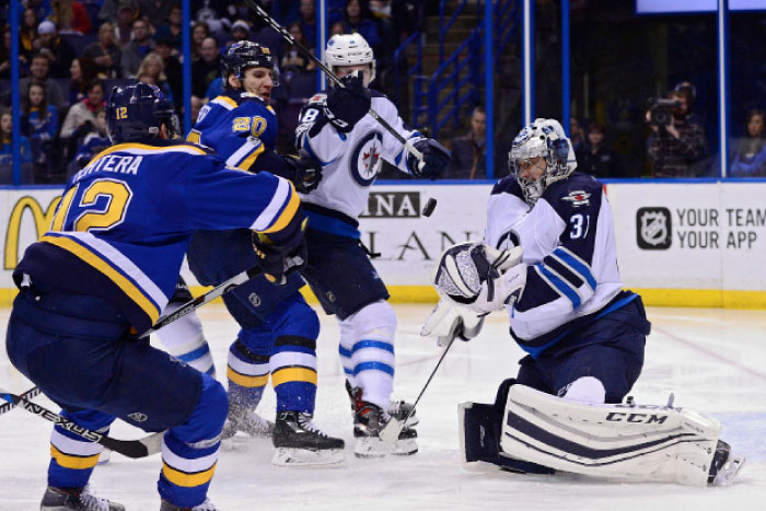 Winnipeg Jets’ goalie Ondrej Pavelec (R) catches the puck out of the air as defenseman Jacob Trouba (2nd R) defends against St. Louis Blues left wing Alexander Steen (2nd L) and center Jori Lehtera during their NHL game at Scottrade Center in St Louis Tuesday. — Reuters