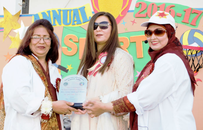 VP Farhat Naeem and DPE Fatima Sabiha presenting honorary shield to wife of CG Soniya Sheryar. — Courtesy photos