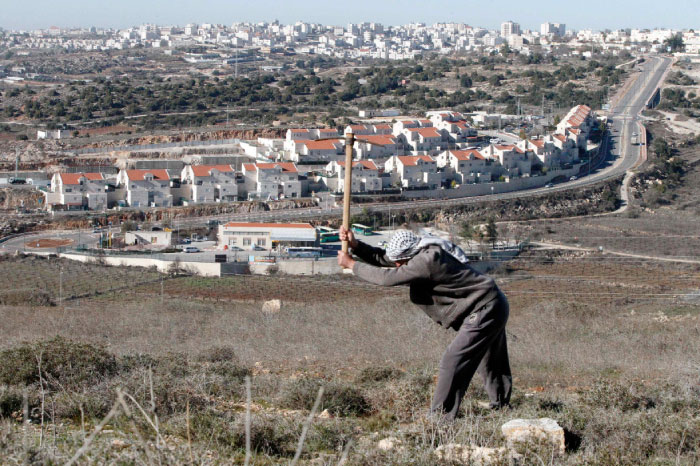 A picture taken from the West Bank city of Hebron on Tuesday shows a view of the Kiryat Arba Jewish settlement on the outskirts of the Palestinian city. — AFP