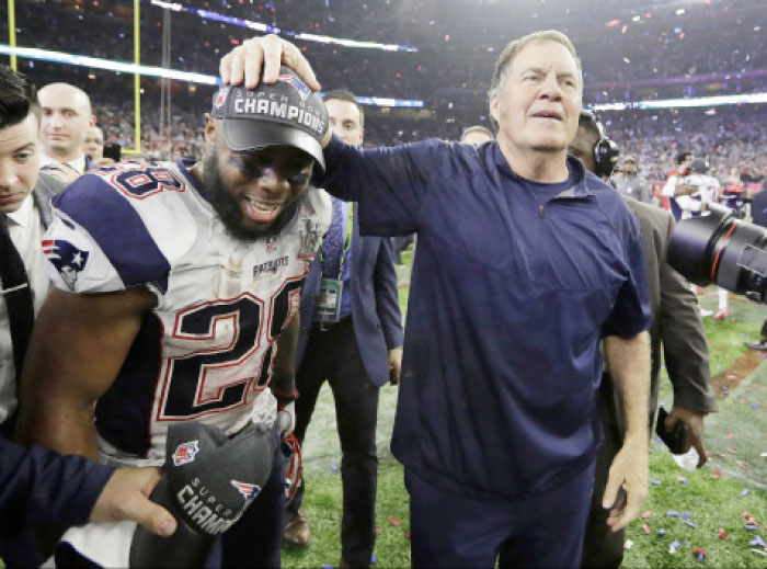 New England Patriots head coach Bill Belichick celebrates with James White after the NFL Super Bowl 51 football game against the Atlanta Falcons Sunday, in Houston. — AP