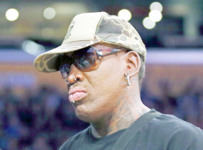 This file photo shows former NBA basketball player Dennis Rodman at an NBA basketball game in Los Angeles. — AP