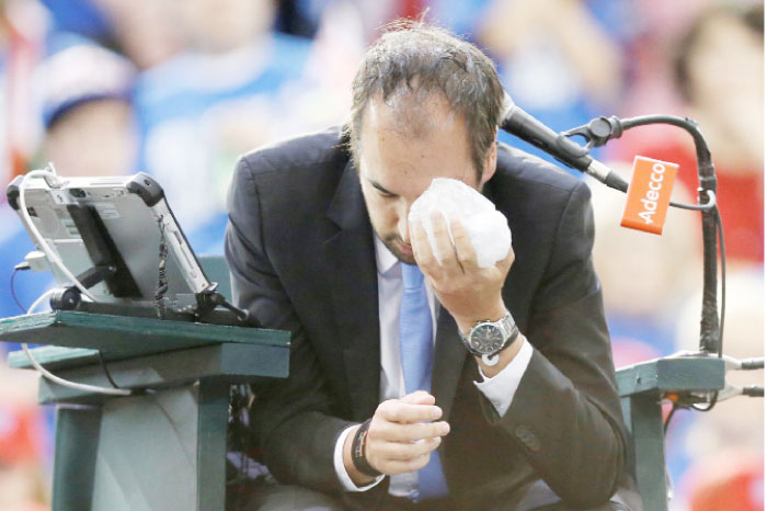 Umpire Arnaud Gabas holds an ice pack to his eye after being struck by a ball during a singles match between Canada’s Denis Shapovalov and Britain’s Kyle Edmund. – Reuters