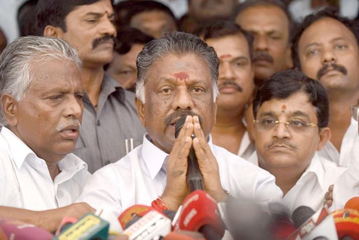 Acting chief minister O Panneerselvam, center, of the southern Indian state of Tamil Nadu gestures during a press conference at his home in Chennai on Tuesday. — AFP