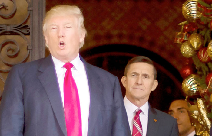 US President-elect Donald Trump, left, is seen with National Security Adviser designate Lt. General Michael Flynn, right, at Mar-a-Lago in Palm Beach, Florida, in this Dec. 21, 2016 file photo. — AFP