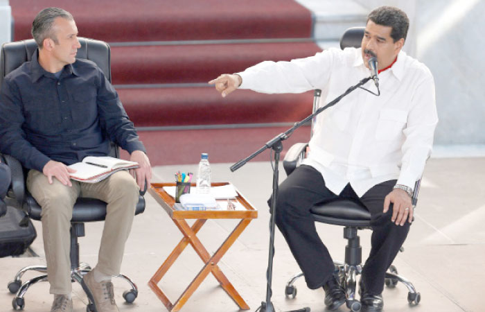 Venezuela’s President Nicolas Maduro, right, speaks next to Venezuela’s Vice President Tareck El Aissami, during a meeting at the Miraflores Palace in Caracas, Venezuela, in this Feb. 2, 2017 file photo. — Reuters
