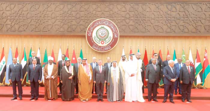 Arab leaders stand for a group photo at the opening of the 28th Arab Summit in Sweimeh on the Dead Sea coast in Jordan on Wednesday. — Reuters