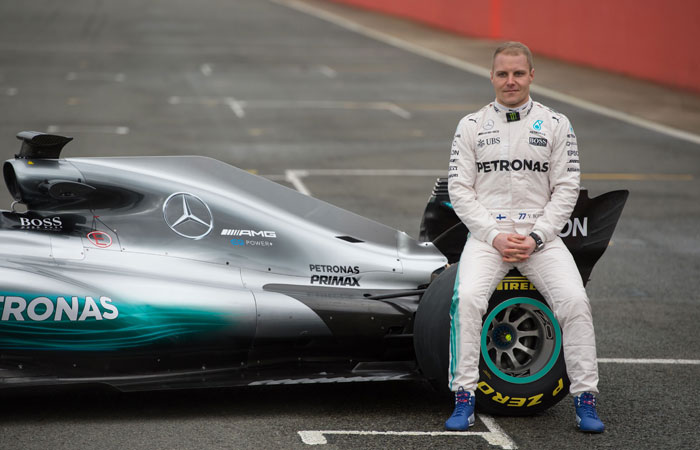 This file photo shows Mercedes AMG Petronas Formula One driver Finland's Valtteri Bottas sitting on the new 2017 season Mercedes W08 EQ Power+ Formula One car at its launch event at Silverstone motor racing circuit near Towcester, central England. — AFP