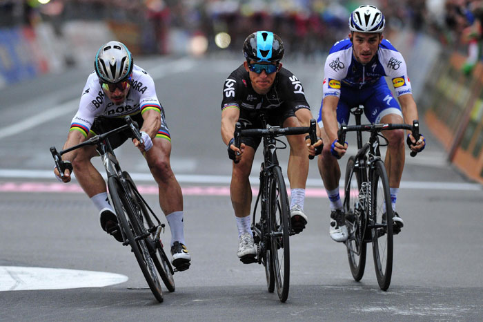 First-placed Michal Kwiatkowski (C) crosses the finish line flanked by second-placed Peter Sagan (L) and third-placed Julian Alaphilippe at the 108th edition of the Milano-Sanremo Cycling Race from Milan to Sanremo, in Milan, Italy, Saturday. — AP