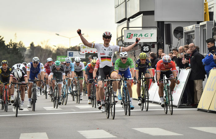 Germany's Andre Greipel celebrates as he crosses the finish line at the end of the 199,5 km fifth stage of the 75th edition of the Paris-Nice cycling race, between Quincie-en-Beaujolais and Bourg-de-Peage, Thursday. — AFP