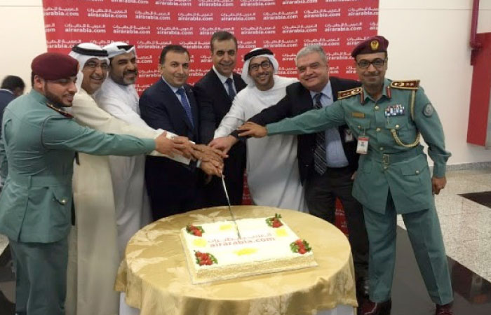 Cutting of ceremonial cake at the  Air Arabia launch of its inaugural service from Sharjah to Baku