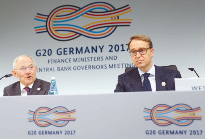 German Bundesbank President Jens Weidmann and German Finance Minister Wolfgang Schaeuble (left) address a news conference at the G20 Finance Ministers and Central Bank Governors Meeting in Baden-Baden, Germany on saturday. — Reuters