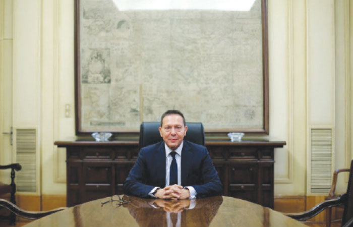 Governor of the Central Bank of Greece Stournaras poses for a picture during an interview with Reuters at the bank’s headquarters in Athens