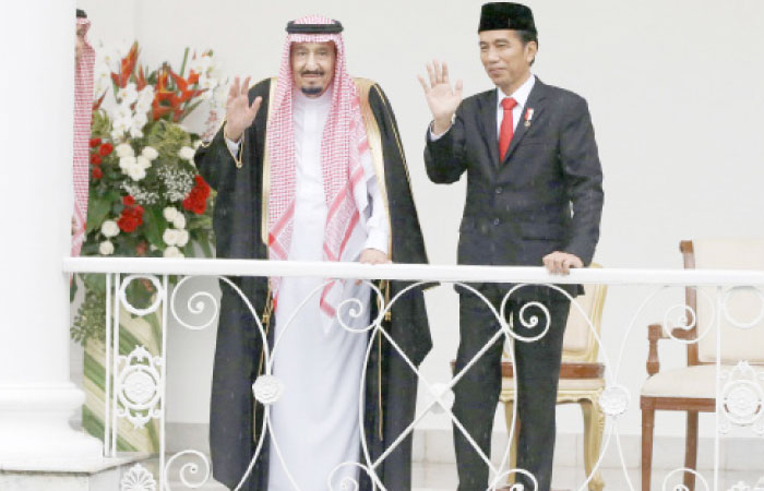 Custodian of the Two Holy Mosques King Salman and Indonesian President Joko Widodo wave to the crowd from the presidential palace in Bogor, West Java, Indonesia, Wednesday. — Reuters