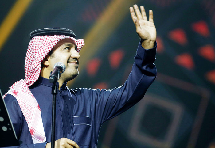 Saudi Arabian singer Rashed Al-Majed waves during his performance. — Reuters
