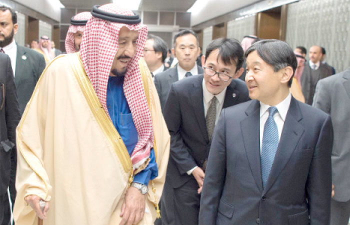 Custodian of the Two Holy Mosques King Salman being received by Crown Prince Naruhito of Japan at Haneda International Airport in Tokyo on Sunday. — SPA