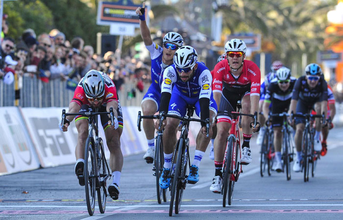 Fernando Gaviria, center, sprints ahead of Peter Sagan to win the sixth stage of the Tirreno Adriatico cycling race from Ascoli Piceno to Civitanova Marche, Italy, Monday. — AP