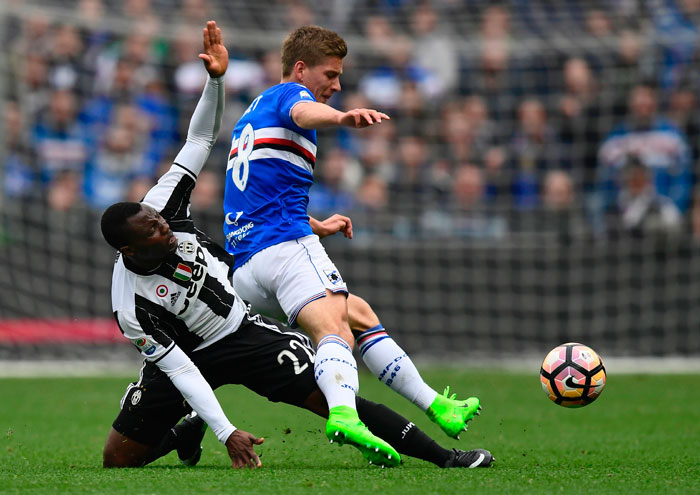 Sampdoria's midfielder Dennis Praet (R) vies with Juventus' Ghana midfielder Kwadwo Asamoah during the Italian Serie A football match at the Luigi Ferraris stadium in Genova on Sunday. — AFP