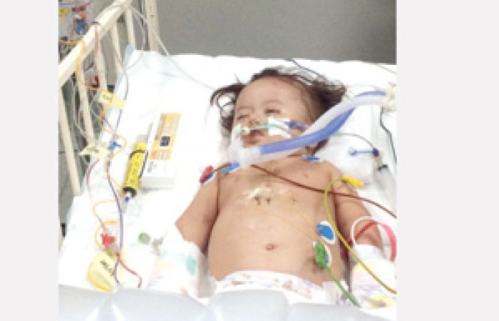 One-year-old Abdullah Al-Harithi remains hospitalized in Taif while his mother is forced to work in a school in Abu Areesh in Jazan region. – Courtesy Al-Watan