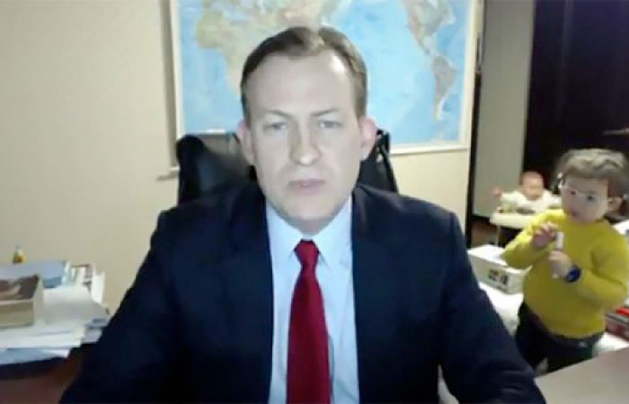 Screenshot shows Robert E. Kelly during an interview with the BBC with his children in the background.