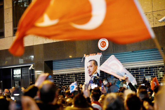 Demonstrators gather ahead of clashes with riot police outside the Turkish consulate in Rotterdam, Netherlands. — Reuters