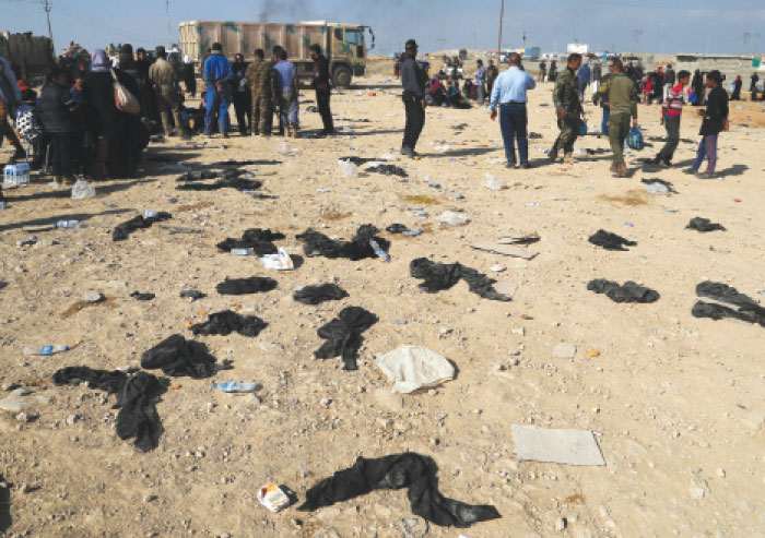 Discarded veils at the entrance of a screening center south of Mosul where civilians fleeing Daesh-held neighborhoods are gathered before being moved to camps, on the western side of Mosul. — AP