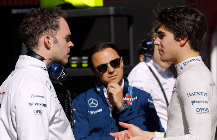 Williams driver Lance Stroll of Canada, right, talks with a team member while fellow driver Felipe Massa, center, of Brazil, looks on during a Formula One pre-season testing session at the Catalunya racetrack in Montmelo, outside Barcelona, Spain. — AP