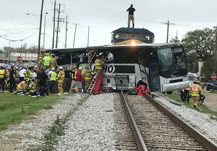 Biloxi firefighters help passengers escape the wreckage after a train traveling from Austin, Texas, collided with a charter bus in Biloxi, Mississippi, on Tuesday. — Reuters