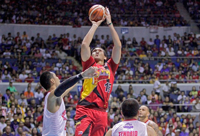 San Miguel Beer's June Mar Fajardo fires a shot off Barangay Ginebra's Japeth Aguilar in Game 5 of the 2017 PBA Philippine Cup Finals at the Smart-Araneta Coliseum Sunday night.