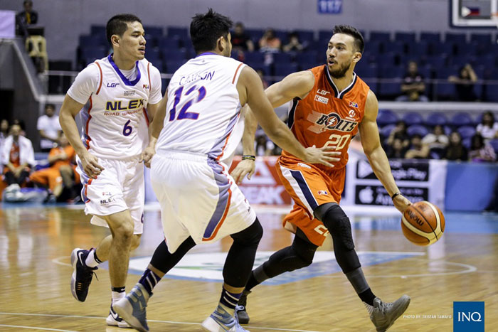 Meralco's Jared Dillinger (R) gets double-teamed by NLEX's Kevin Alas (L) and Eric Camson in their PBA Commissioner's Cup game at the Smart-Araneta Coliseum Sunday night.