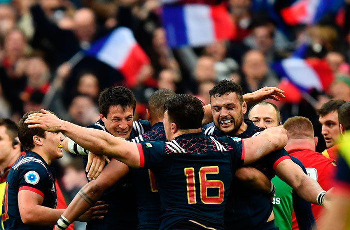 France's center François Trinh-Duc (2nd L), France's Number Eight Damien Chouly (R) and teammates react after scoring a try during the Six Nations Rugby Union match against Wales at the Stade de France in Saint-Denis, outside Paris, Saturday. — AFP