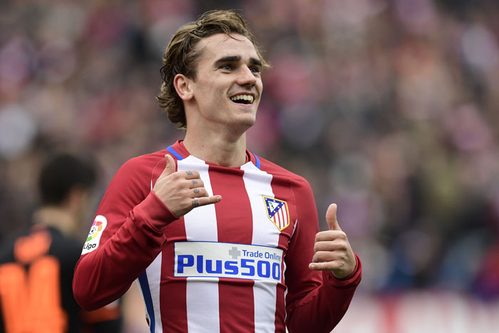 Atletico Madrid's French forward Antoine Griezmann celebrates a goal during their Spanish league football match against Valencia at the Vicente Calderon Stadium in Madrid Sunday. — AFP