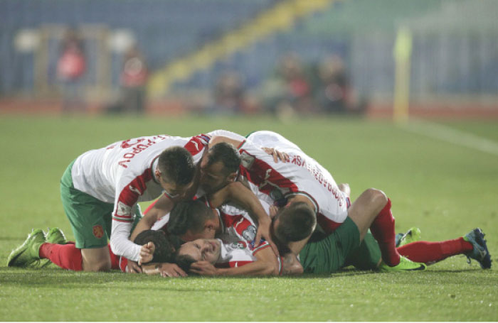 Bulgaria’s Spas Delev and teammates celebrate after scoring a goal against the Netherlands during their 2018 World Cup qualifier in Sofia Saturday. — Reuters