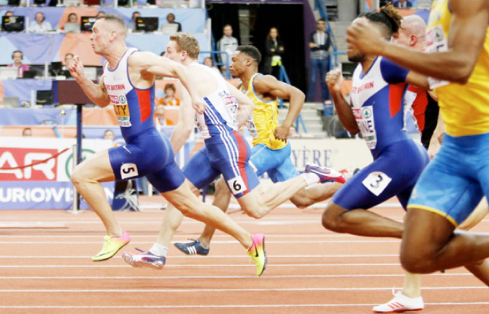Britain’s Richard Kilty (L) races to win the men’s 60m final during the European Athletics Indoor Championships in Belgrade, Serbia, Saturday. — AP
