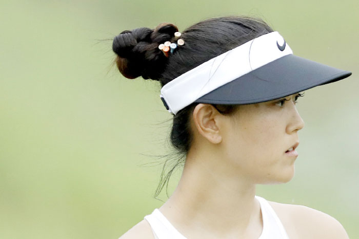 Michelle Wie of the US watches her ball on the 8th hole during the HSBC Women’s Champions Golf Tournament in Singapore Saturday. — AP