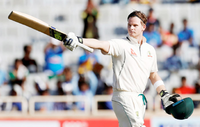 Australia skipper Steven Smith celebrates his century against India during the third Test cricket match at the Jharkhand State Cricket Association Stadium, Ranchi, India, Thursday. — Reuters