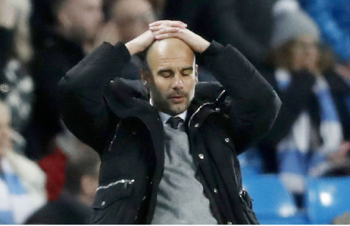 Manchester City manager Pep Guardiola reacts during their match against Stoke City Wednesday. — Reuters