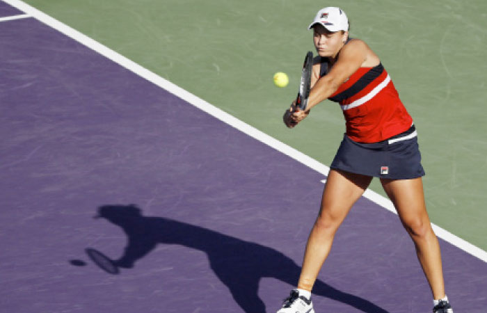Ashleigh Barty of Australia hits a backhand against Eugenie Bouchard of Canada at the 2017 Miami Open Wednesday. — Reuters