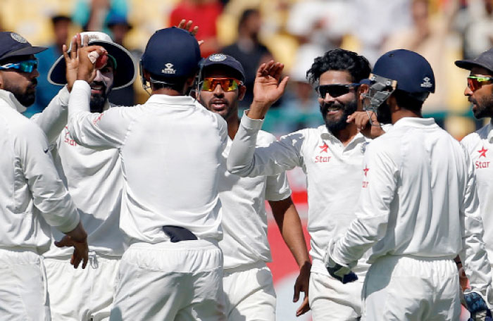 India's Ravindra Jadeja (3-R) celebrates with his teammates after dismissing Australia's Shaun Marsh during the fourth cricket Test match at Dharamsala, India, on Monday. — Reuters