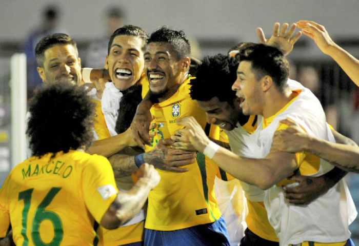 Brazil’s midfielder Paulinho (C) celebrates a goal with teammates during their 2018 FIFA World Cup qualifier against Uruguay at the Centenario Stadium in Montevideo Thursday. — AFP