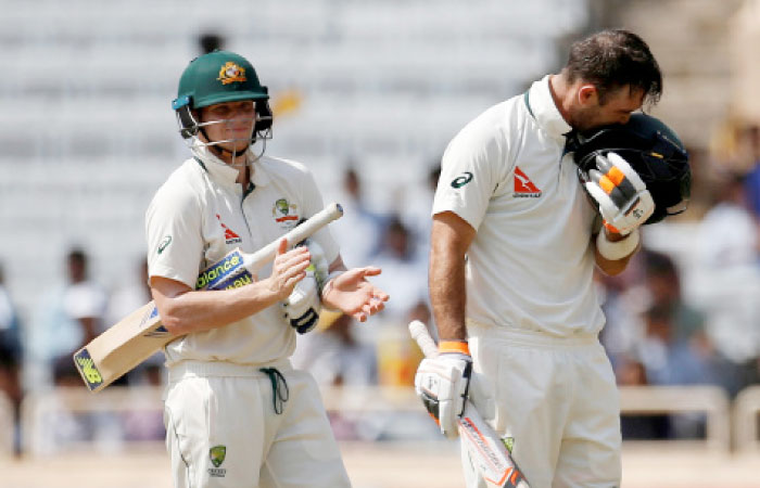 Australia’s Glenn Maxwell celebrates his century as captain Steven Smith (L) watches during the third cricket Test against India at the Jharkhand State Cricket Association Stadium in Ranchi Friday. — Reuters