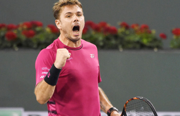 Stan Wawrinka celebrates after defeating Dominic Theim at the Indian Wells Tennis Garden Thursday. — Reuters