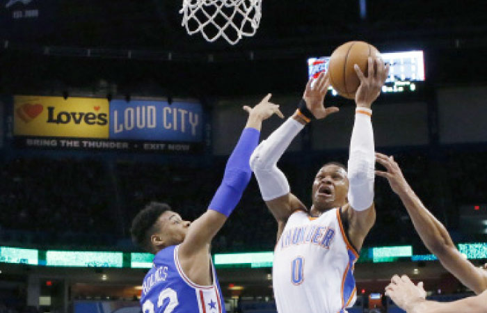 Oklahoma City Thunder’s guard Russell Westbrook shoots in front of Philadelphia 76ers’ forward Richaun Holmes during their NBA game in Oklahoma City Wednesday. — AP