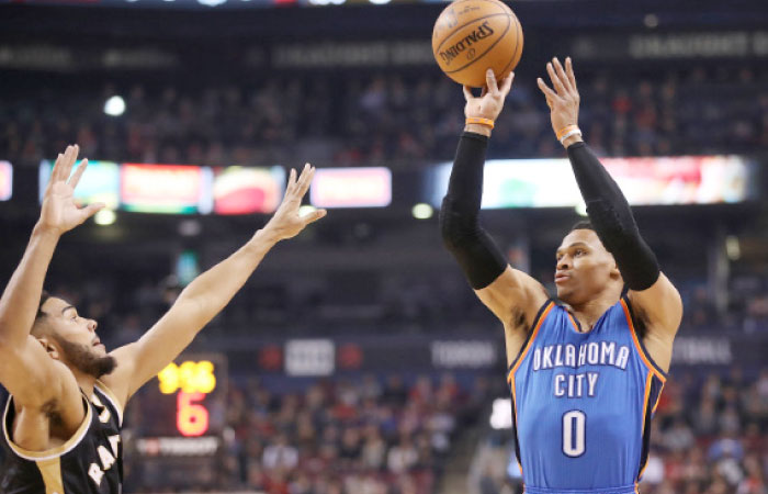 Oklahoma City Thunder’s point guard Russell Westbrook shoots as Toronto Raptors’ point guard Cory Joseph defends at Air Canada Centre in Toronto Thursday. — Reuters