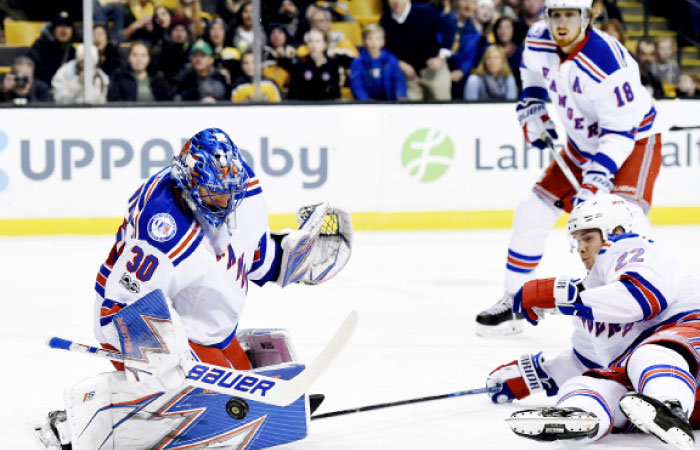 New York Rangers’ goalie Henrik Lundqvist (L) makes a save during their NHL game against the Boston Bruins at TD Garden in Boston Thursday. — Reuters