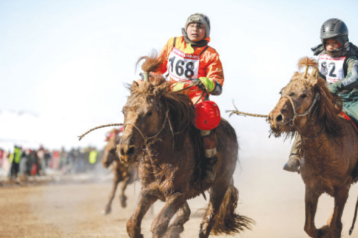 Mongolian child jockeys competing in the “Dunjingarav 2017” spring horse race on the outskirts of Ulan Bator. Mongolian courts banned them, human rights groups slammed them and the labor ministry demands they cease, but none of that has stopped Mongolia’s politicians from letting child jockeys saddle up. — AFP