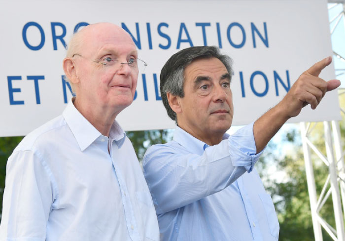 Former French Prime Minister and then candidate for the right-wing Les Republicains (LR) party primary ahead of the 2017 presidential election Francois Fillon, right, points a finger next to his campaign director Patrick Stefanini during a meeting with supporters Sable-sur-Sarthe, western France, in this file photo. — AFP